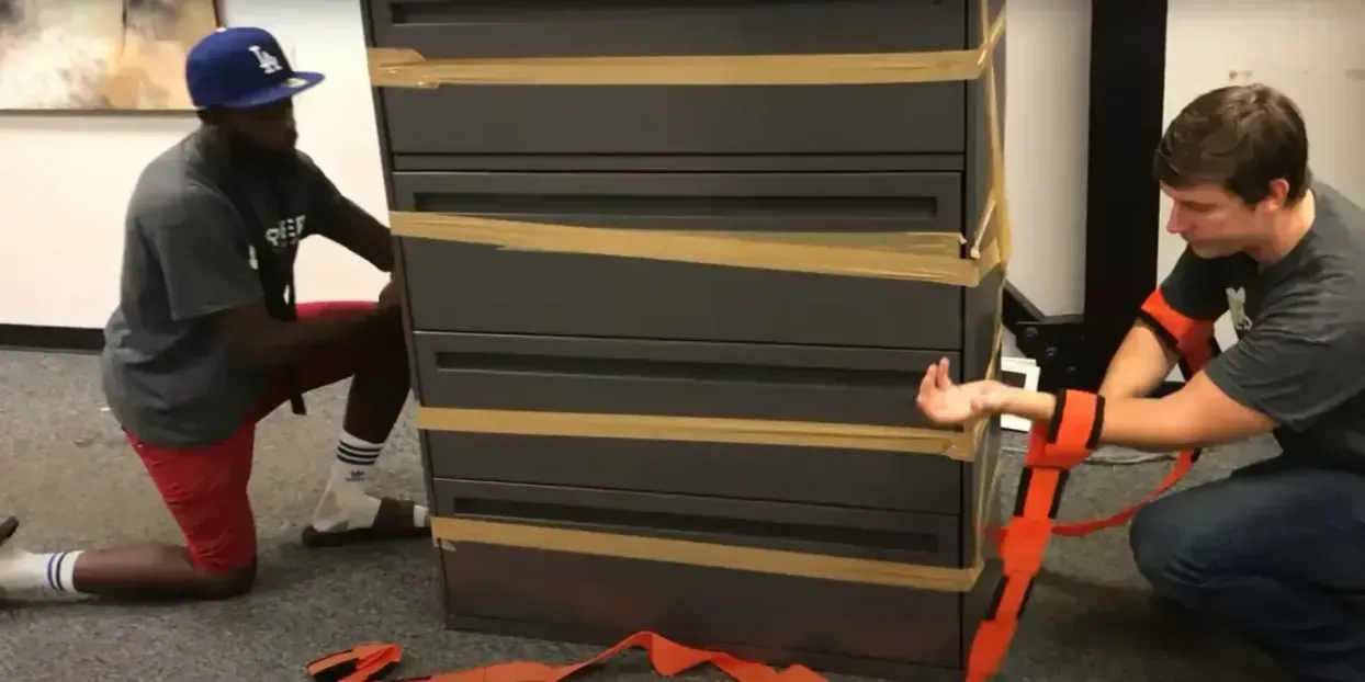 Professional movers carrying boxes